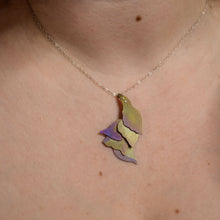 Load image into Gallery viewer, detail of She Wades with Grace Through Changing Tides Necklace on a woman&#39;s neckline, a pink and gold hand-painted titanium necklace of layered organic shapes similar to flower petals or feathers

